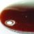 Cabochon ovale 18/13mm. Ambre foncé.